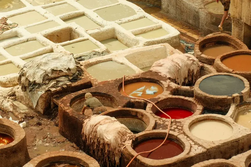 View of the historic leather tannery in Fes, capturing traditional dyeing vats and processes